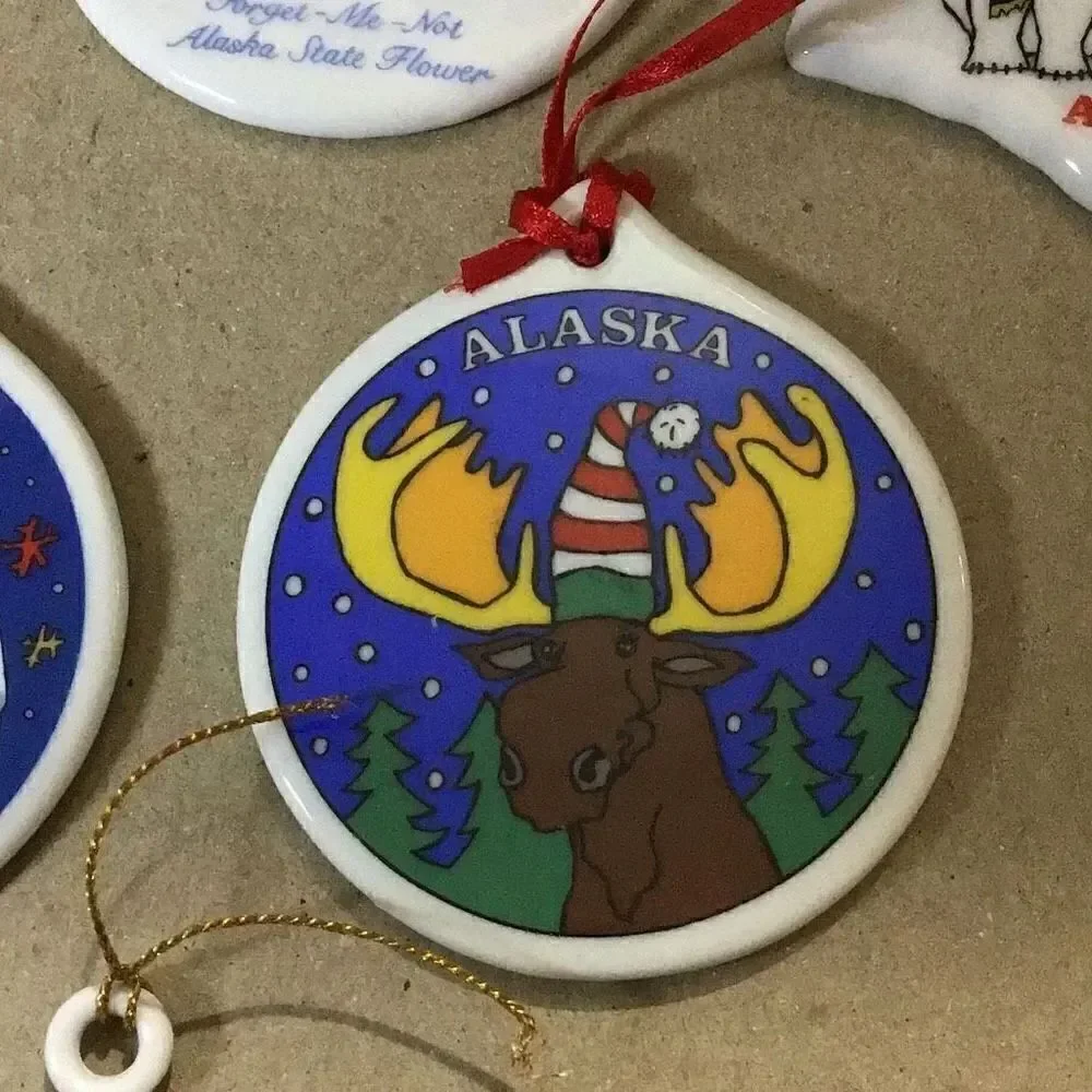 Set of six porcelain desk ornaments mostly Alaskan